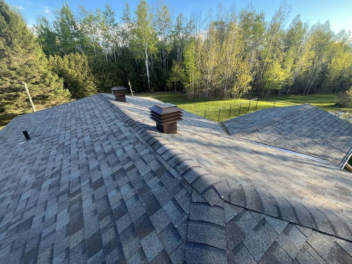 Completed asphalt shingle roof by Rob's Quality Roofing near Metcalfe, Ontario