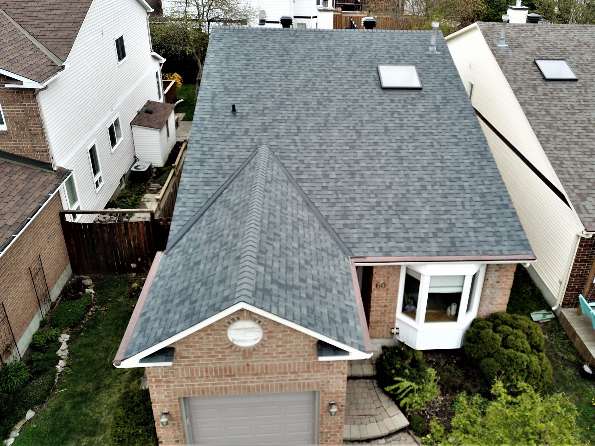 Completed asphalt shingle roof by Rob's Quality Roofing near Munster, Ontario