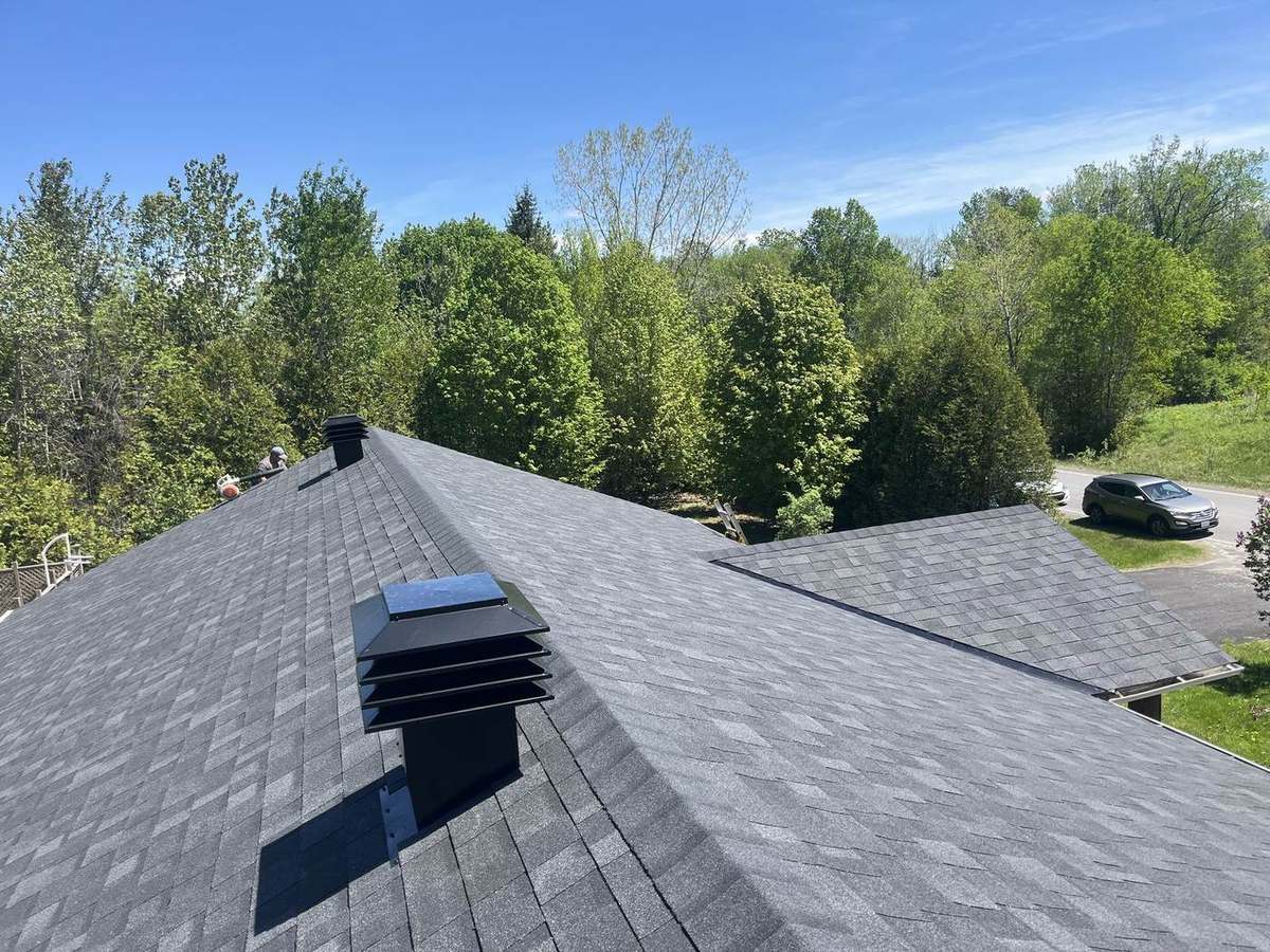 Completed asphalt shingle roof by Rob's Quality Roofing near Nepean, Ontario