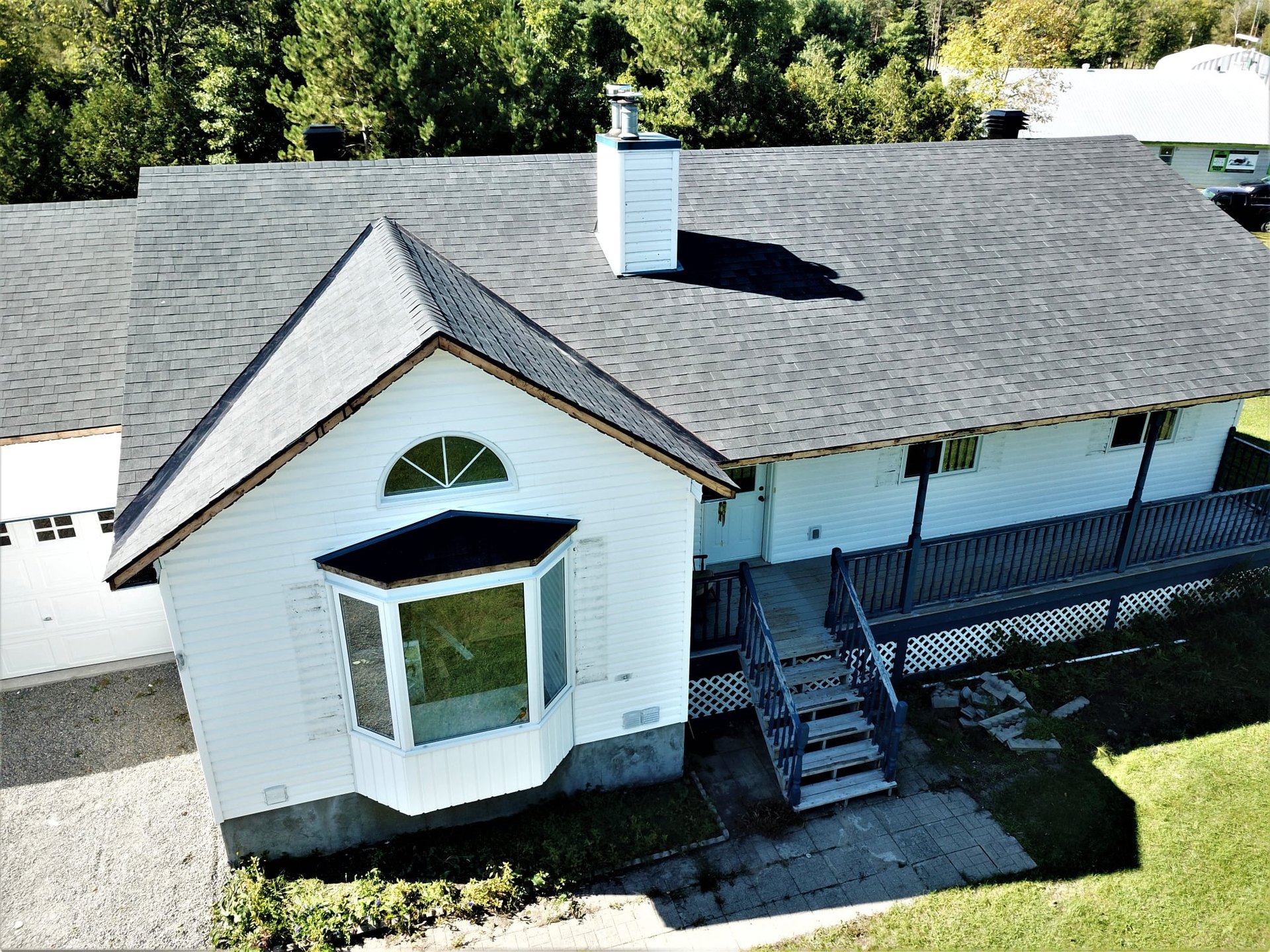 Completed asphalt shingle roof by Rob's Quality Roofing near Greely, Ontario