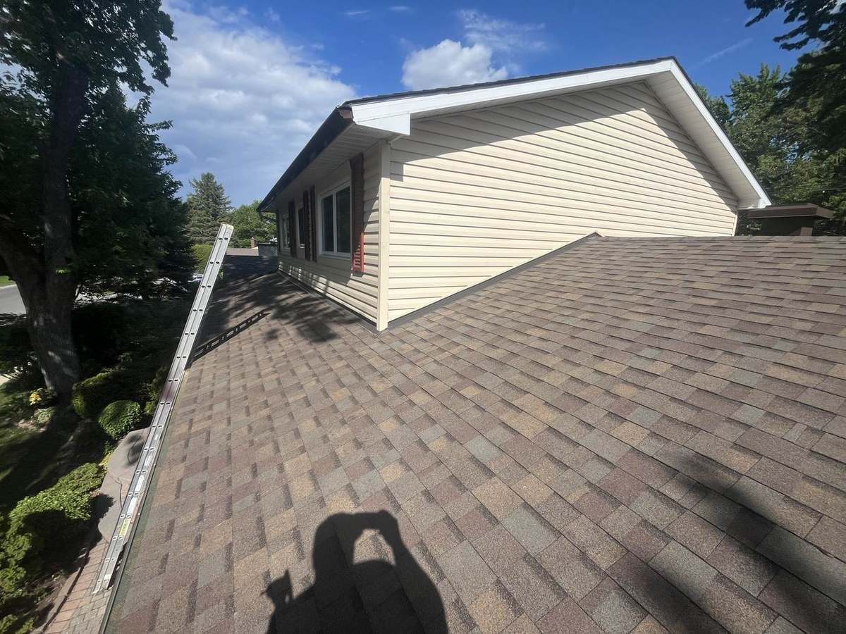 Teak asphalt shingle roof installed by Rob's Quality Roofing in the Ottawa region — project 7
